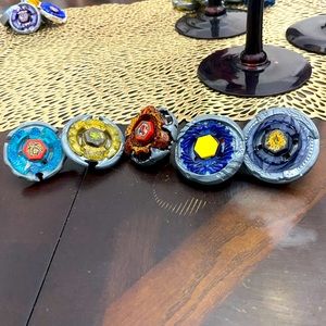Selling beyblades with custom tips, and parts. All assembled. Comes with tool.